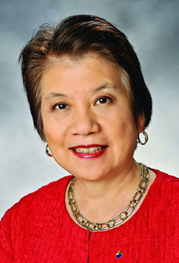 This is a picture of Dr. Marinda Wu wearing a red blouse and an American Chemical Society lapel pin.