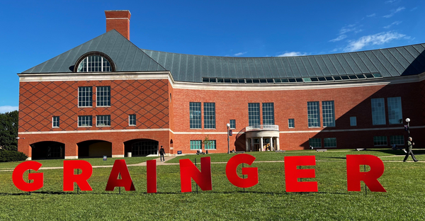 Image of Grainger Library with yard letters spelling out Grainger