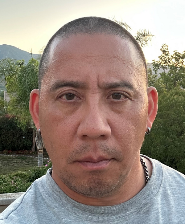 Image of Dylan Rodriguez looking at the camera.