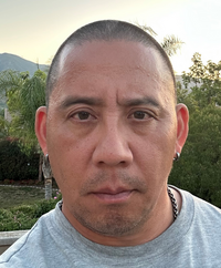 Image of Dylan Rodriguez looking at the camera.