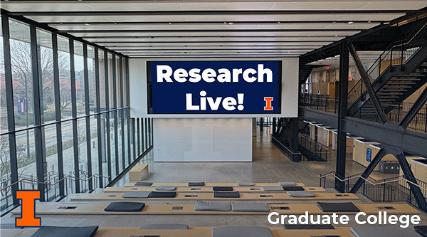 A view of the CIF Atrium. "Research Live!" is on a screen in the center of the space.