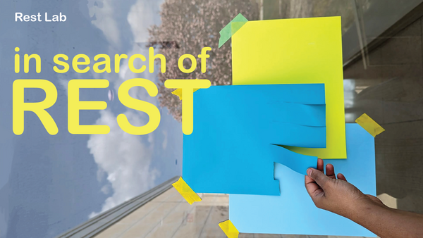 Hand reaching to tear a colorful piece of paper.