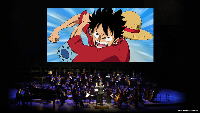Image of symphony orchestra playing below animated images from the One Piece TV series