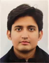 Professor Bhaskar Ray Chaudhury, wearing a black zip-up sweater and looking at the camera