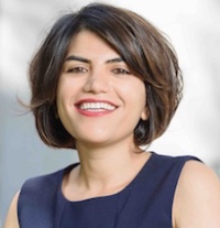 Professor Negin Golrezaei, wearing a navy shirt and smiling
