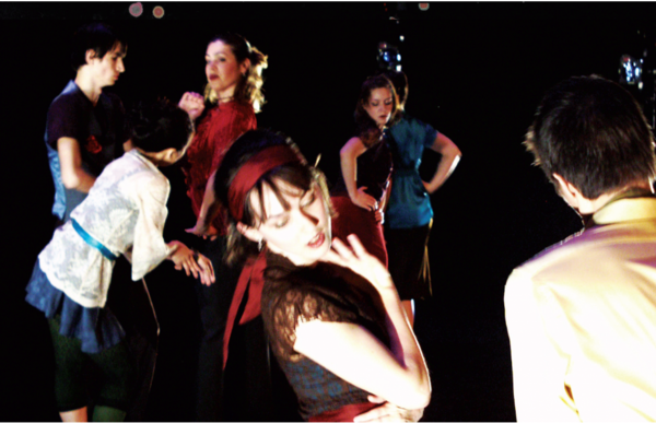 There can be seen various dancers with side glances in red, blue, and cream attire. None of which look directly at the camera.