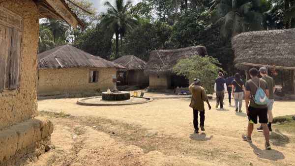 Students walking through village while on study abroad tri.