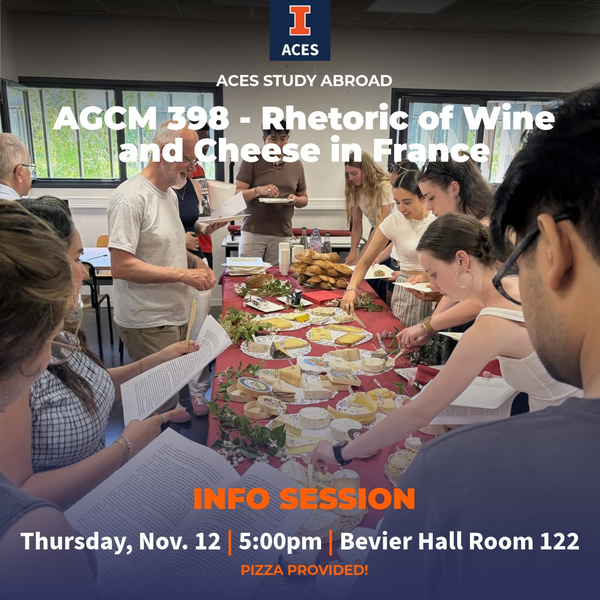 "AGCM 398 - Rhetoric of Wine and Cheese in France. Info Session. Thursday, Nov. 12 | 5:00 pm | Bevier Hall Room 122. Pizza will be provided!" Students standing around a table full of chesses while grabbing some onto plates and reading different pieces of printed paper.