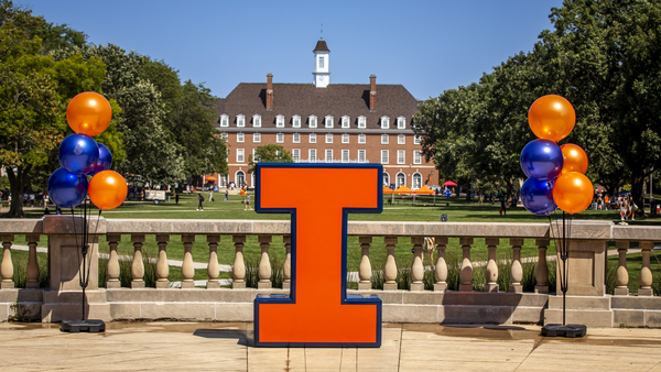 View of Illini Union and Quad with an orange Block I and balloons in front