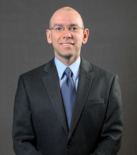 Headshot of Todd Kuhn.