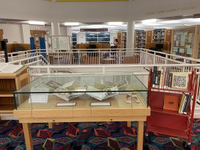 Image of display case with books and examples of confections