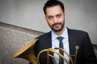Professor Yonatan Kahn with his french horn.