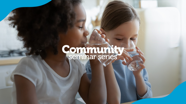 Community Seminar Series. Kids enjoying a glass of water.
