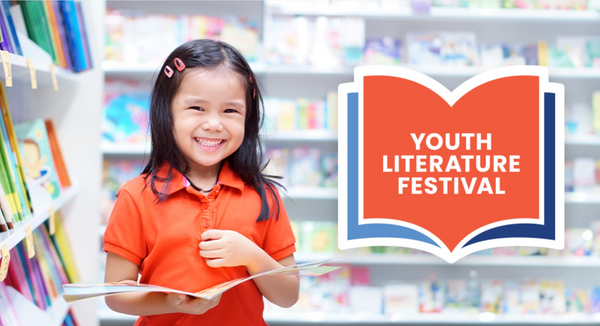A smiling young child in an orange shirt holds an open picture book in a library. Shelves of colorful children’s books fill the background. To the right, a large open-book graphic reads “Youth Literature Festival.”