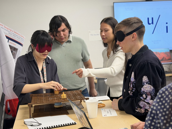 Students playtesting game with blindfolds