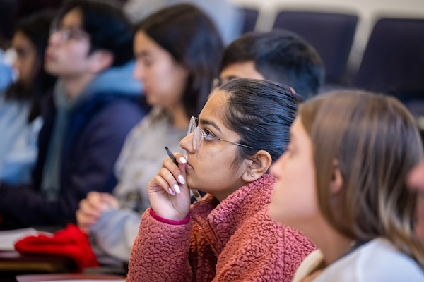 Students in classroom listening to instructor.