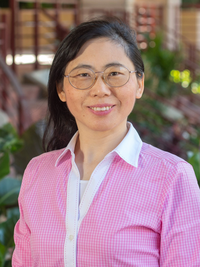 Dr. Julia Qu - person with medium length dark hair and glasses.