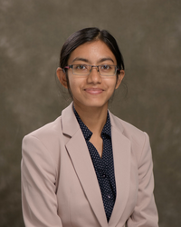 Female with dark hair and glasses